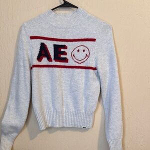 American Eagle Outfitters Light Gray Sweater with Red and Black Design